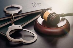 Handcuffs beside mallet and gavel